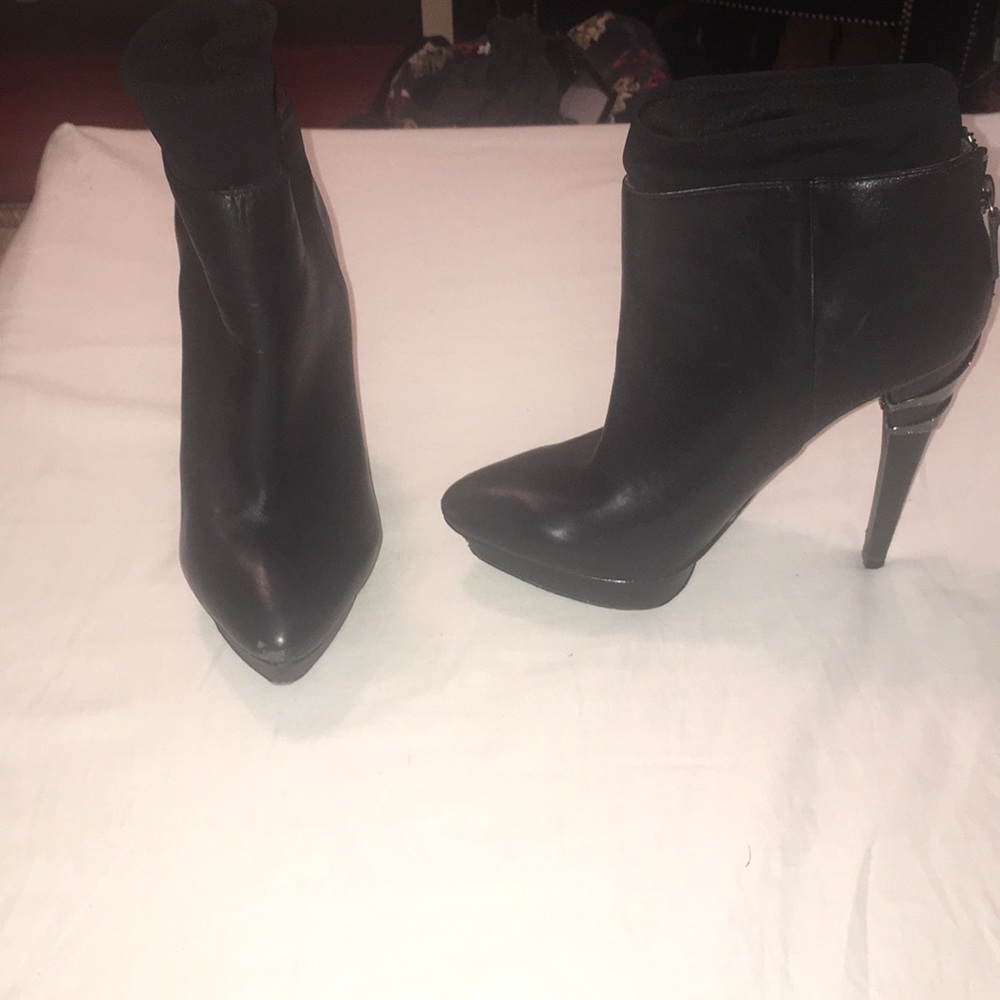 Charles Jourdan heeled booties.